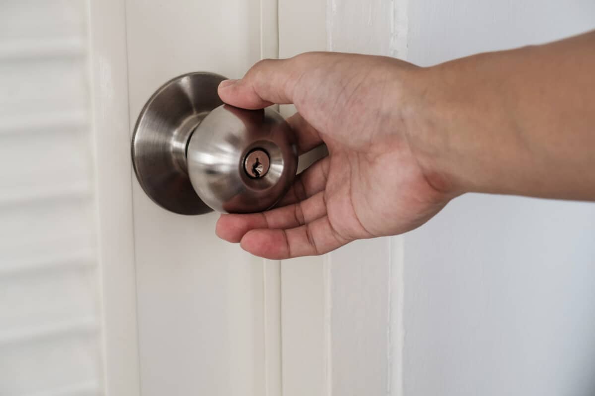 hand holding door knob